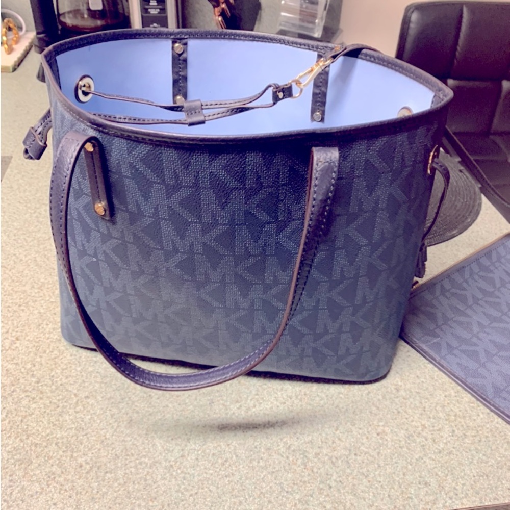 New mk blue tote 11x9 roomy comes with attachable wallet never used